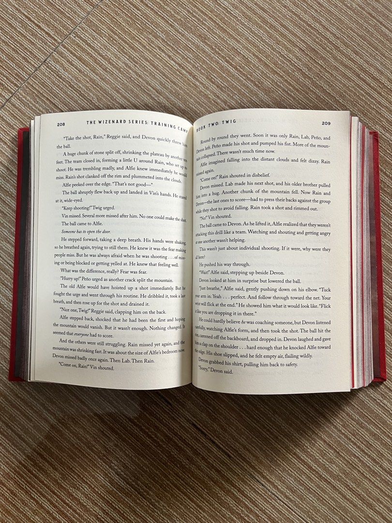 Kobe Bryant Wizenard (Category: Storybooks) located in Pasay City. Submitted by thejunkclosetph (Listing ID 1465773156, Image 2). Description: - Title: The Wizenard Series: Training Camp - Created by: Basketball legend Kobe Bryant - Written by: Wesley King - Format: Hardcover book with striking red cover and gold abstract detailing - Perfect for: Kobe fans, basketball enthusiasts, collectors, and young readers.