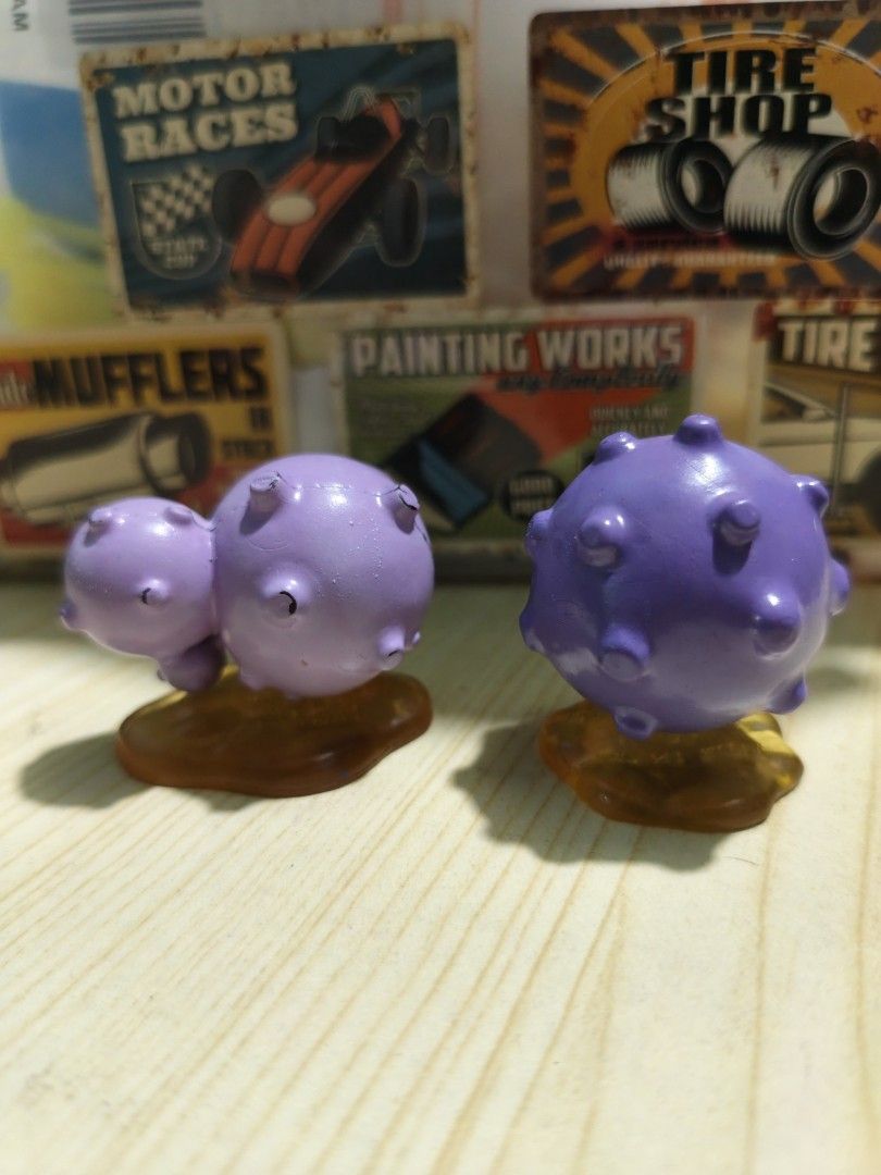 Koffing and Weezing Pokémon figures TOMY (Category: Figurines & Statues) located in Valenzuela. Submitted by chuwie1026 (Listing ID 1465883207, Image 3). Description: - Authentic TOMY Pokémon figures (Koffing & Weezing) - Classic purple design with iconic skull and crossbones details - Mounted on unique orange translucent splash bases - Condition: Good, with slight paint scuffs on the bumps - Perfect addition to any Pokémon collection or desk set