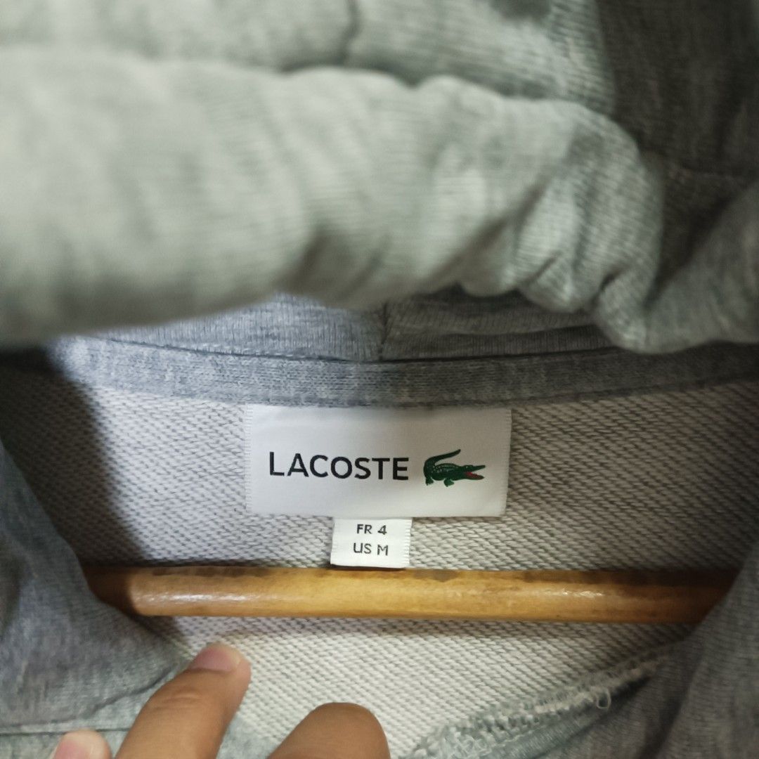 Lacoste Hoodie Gray (Category: Coats, Jackets and Outerwear) located in Marawi City. Submitted by rajieeee (Listing ID 1465887424, Image 3). Description: SALE ‼️500 ONLY‼️ Good Condition Color rate 9.5/10 Authentic 💯 22 by 28 Issue : See last 4 pictures ( easy to repair).