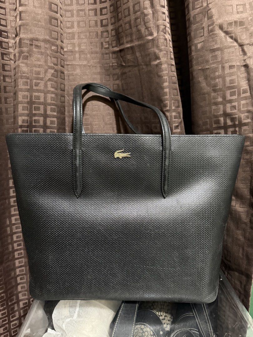 Lacoste leather zippered tote bag (Category: Shoulder Bags) located in Manila. Submitted by rubyjaneba27331 (Listing ID 1465839261, Image 1). Description: With dust bag Fits 15inch laptop Spacious 📍upper Antipolo.