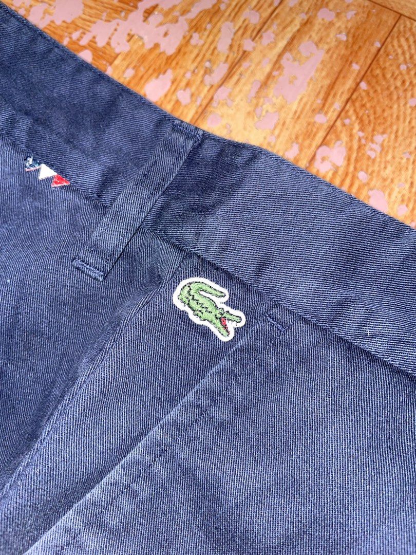 Lacoste Live Navy Blue Shorts US 34 (Category: Shorts) located in Tanjay. Submitted by wilddog.579f1a (Listing ID 1465875988, Image 2). Description: - Brand: Lacoste Live - Color: Navy Blue - Size: US 34 / EU 44 - Material: 100% Cotton - Features: Classic button closure, belt loops, and iconic embroidered crocodile logo near the waistband - Condition: Clean, excellent, and ready to wear - Perfect for casual everyday styling.