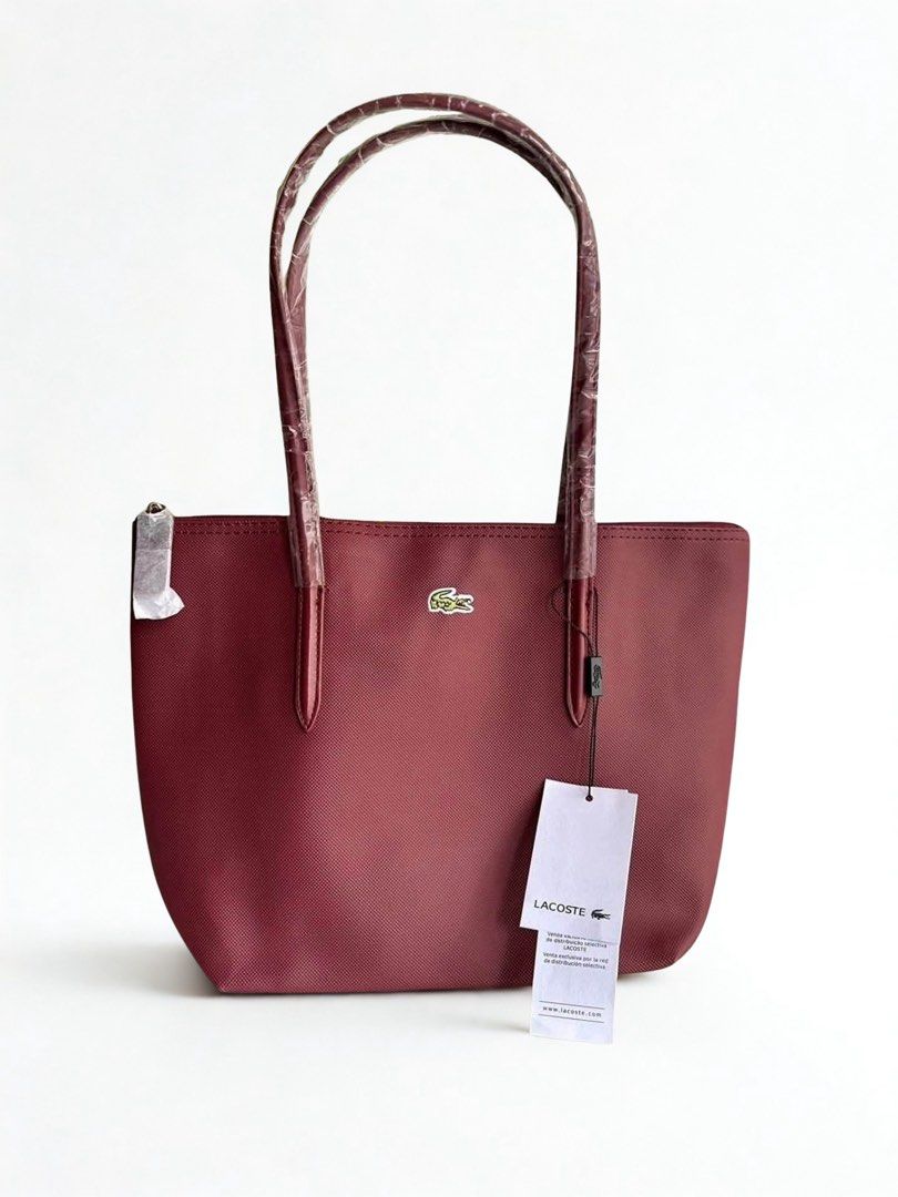 Lacoste Maroon Vertical Tote Bag (Category: Announcements) located in Mandaluyong City. Submitted by bayline999 (Listing ID 1465771912, Image 1). Description: .