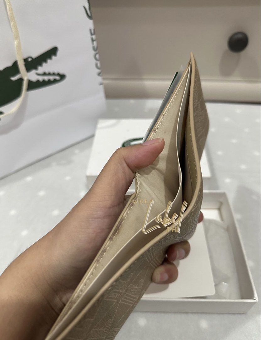 Lacoste Men's Monogram Leather Bifold Wallet (Category: Wallets & Card Holders) located in Manila. Submitted by deiclacio_ (Listing ID 1465802183, Image 3). Description: discoloration .