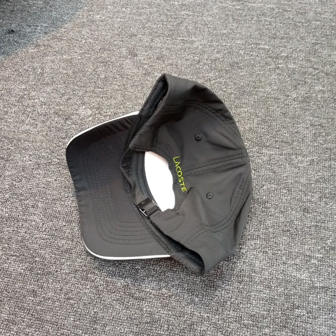 Lacoste Sport Black Cap with Graphic Logo (Category: Caps & Hats) located in Manila. Submitted by pablopresk0. (Listing ID 1465834511, Image 2). Description: - Brand: Lacoste Sport - Color: Black with lime green embroidery and white brim piping - Features: Bold front graphic, adjustable strap with metal buckle, branded inner taped seams Manila location📍 Pm if Interested📩.