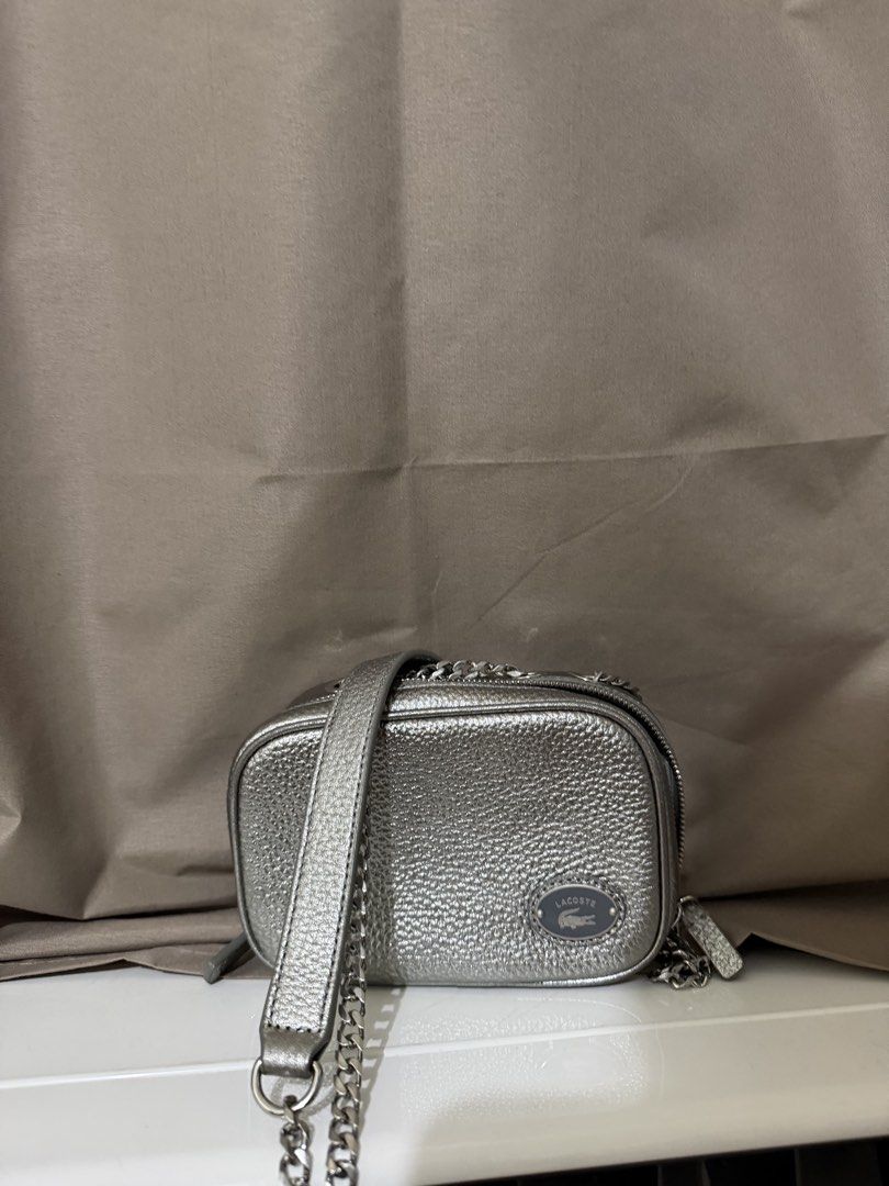 Lacoste Top Grain Leather Square Shoulder Bag (Category: Cross-body Bags) located in Quezon City. Submitted by declutterbycy (Listing ID 1465833528, Image 1). Description: Sling Bag with adjustable Strap Silver metallic crocodile Declutter .