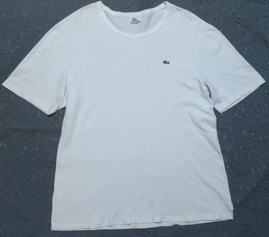 Lacoste White Crew Neck T-Shirt Size 6 (Category: Activewear) located in Las Pinas. Submitted by huslerz (Listing ID 1465764513, Image 1). Description: - Brand: Lacoste - Style: Classic crew neck t-shirt - Color: White with iconic embroidered green crocodile logo on left chest - Size: 6 - Material: Soft, comfortable cotton - Condition: Pre-owned with a minor yellow stain near the collar rim (see close-up photo) - Perfect for casual everyday wear 