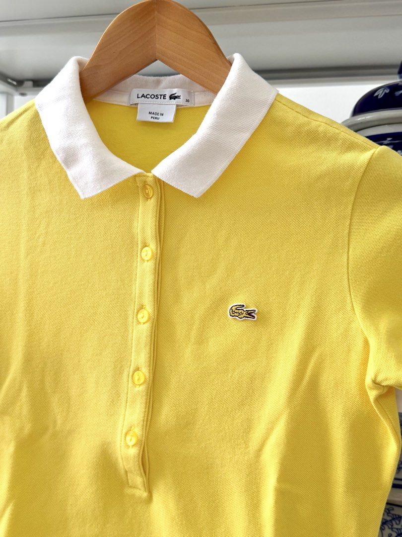 Lacoste Yellow Polo Shirt Size 36 (Category: Babies & Kids Fashion) located in Lipa City. Submitted by pauline0303 (Listing ID 1465765772, Image 2). Description: - Brand: Lacoste - Authentic - Color: Bright yellow with contrasting white collar and sleeve cuffs - Size: 36 (Made in Peru) - Details: Classic 5-button placket and embroidered green crocodile logo on chest - Condition: Clean fabric with solid stitching - Style: Great staple piece for ca
