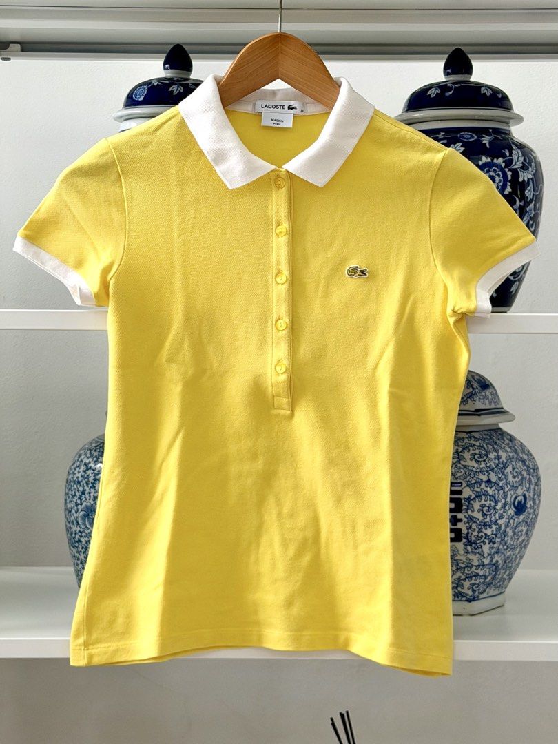 Lacoste Yellow Polo Shirt Size 36 (Category: Babies & Kids Fashion) located in Lipa City. Submitted by pauline0303 (Listing ID 1465765772, Image 1). Description: - Brand: Lacoste - Authentic - Color: Bright yellow with contrasting white collar and sleeve cuffs - Size: 36 (Made in Peru) - Details: Classic 5-button placket and embroidered green crocodile logo on chest - Condition: Clean fabric with solid stitching - Style: Great staple piece for ca