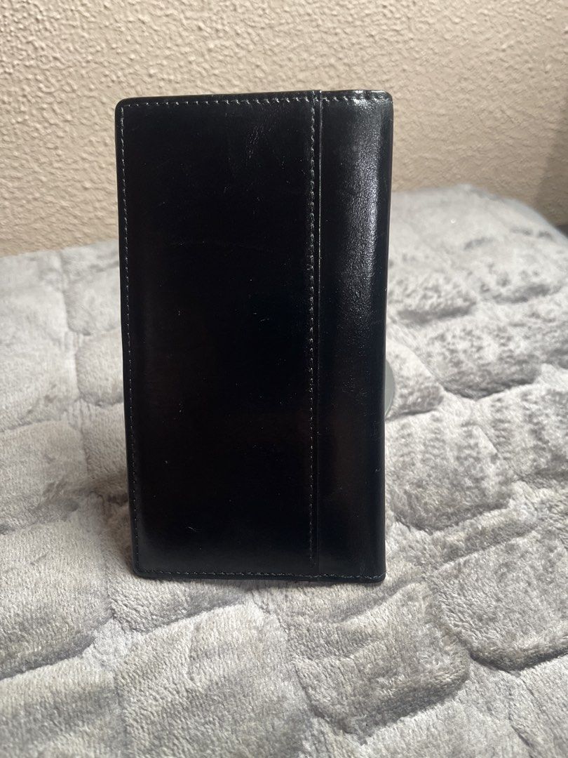 Lanspace Black Leather Long Wallet Card Holder (Category: Wallets & Card holders) located in Quezon City. Submitted by donnabelle7572 (Listing ID 1465933272, Image 2). Description: - Brand: Lanspace - Material: Black genuine leather - Condition: Clean interior and exterior, well-maintained structure - Storage: Plenty of card slots on both sides - Lining: Stylish patterned fabric in the bill compartment - Ideal for: Everyday organization of cards 