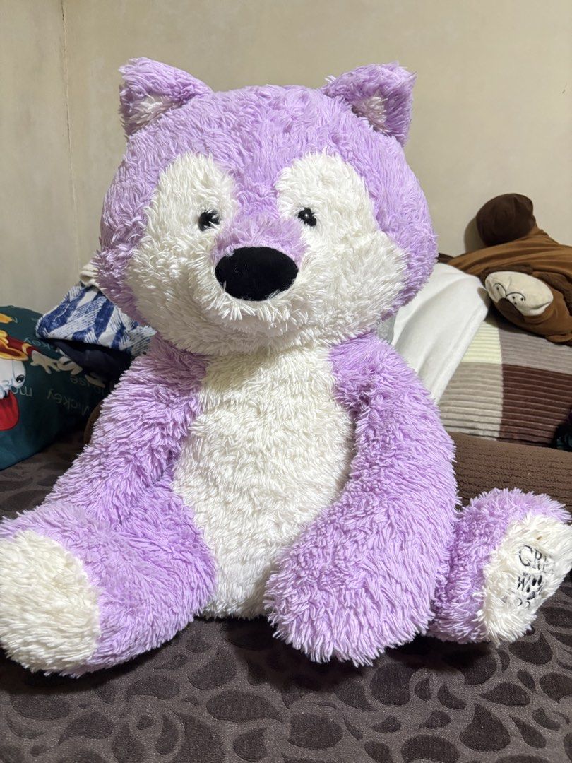 Large purple and white fluffy wolf stuffed animal (Category: Plushies & Soft Toys) located in Cavite. Submitted by jiyoungdcruz30 (Listing ID 1465940896, Image 2). Description: - Super soft and fluffy purple and white fur - Sitting style design, very huggable - Features cute pointy ears and a black nose - Clean and well-maintained texture - Perfect as a cuddle buddy or bedroom decor - pede i dry clean kung maselan Pede pa din pang gift diskarte l