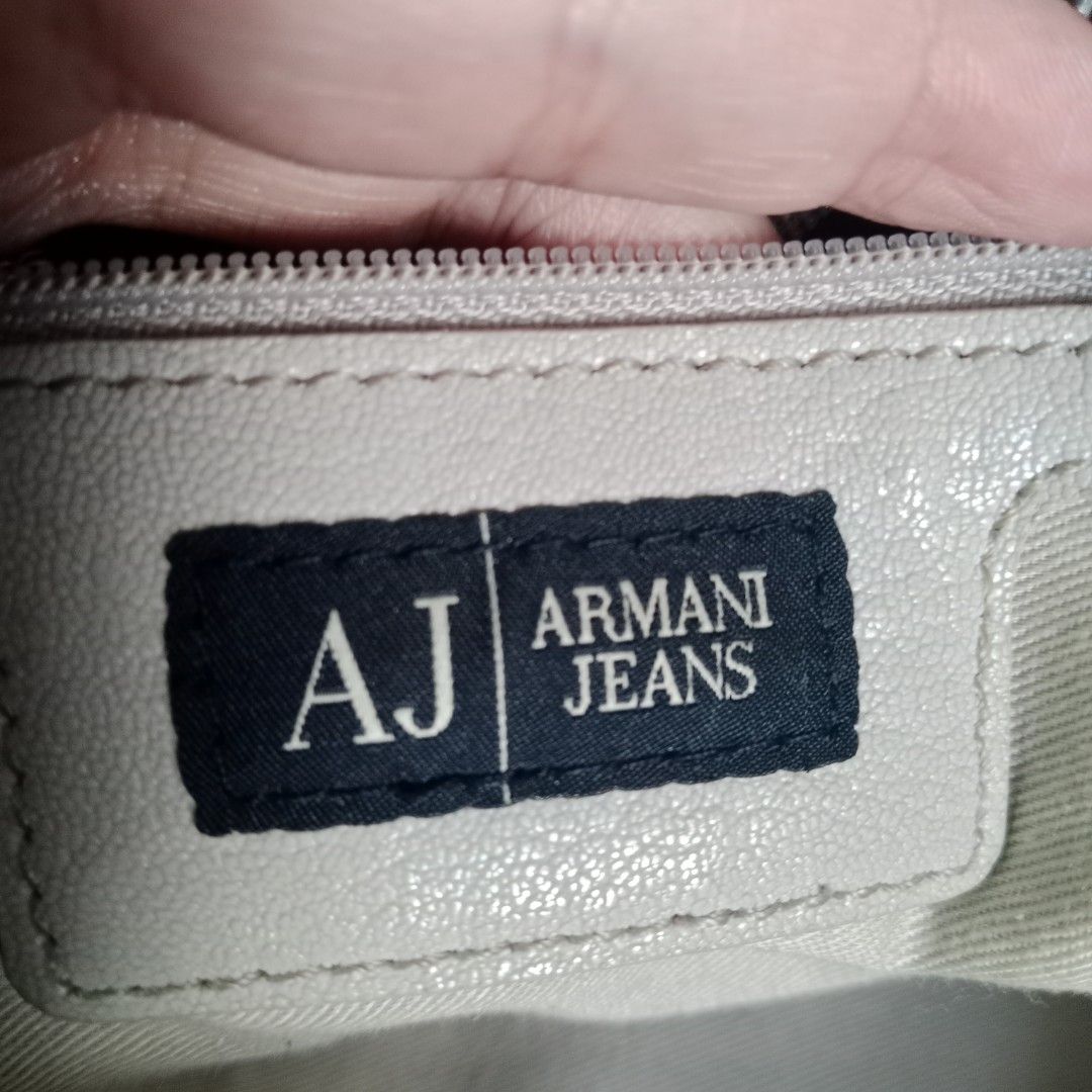 Large Shoulder Bag (Category: Shoulder Bags) located in Manila. Submitted by mamapards17 (Listing ID 1465805483, Image 3). Description: AR--MAN--I Jeans shoulder bag featuring dual front zippered pockets, side slip pockets and silver-tone hardware branding..