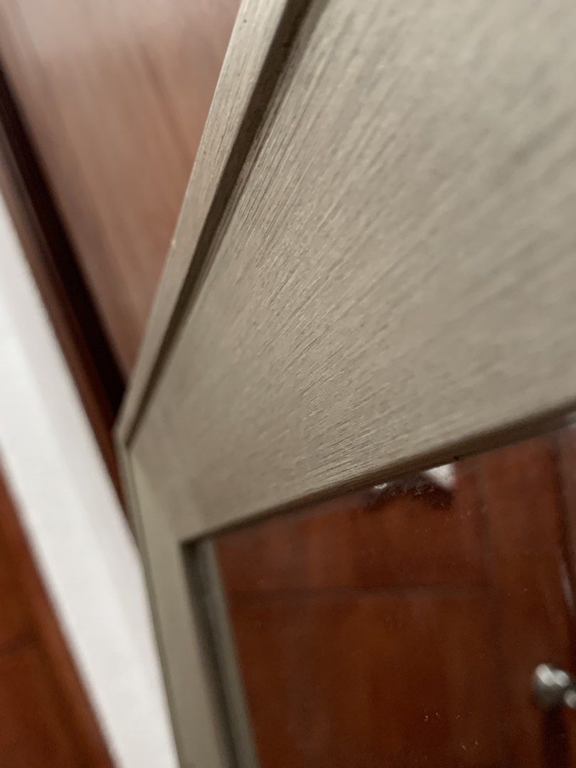 Large Wooden Framed Wall Mirror (Category: Mirrors) located in Bangui. Submitted by chaaaz_ (Listing ID 1465769787, Image 3). Description: - Large rectangular wall mirror with a sturdy wooden frame - Elegant brushed grey finish with classic mitered corners - Heavy and durable construction with a clean, distortion-free glass surface - Versatile design: can be hung both vertically or horizontally - Neutral tone that effortlessly matches living room