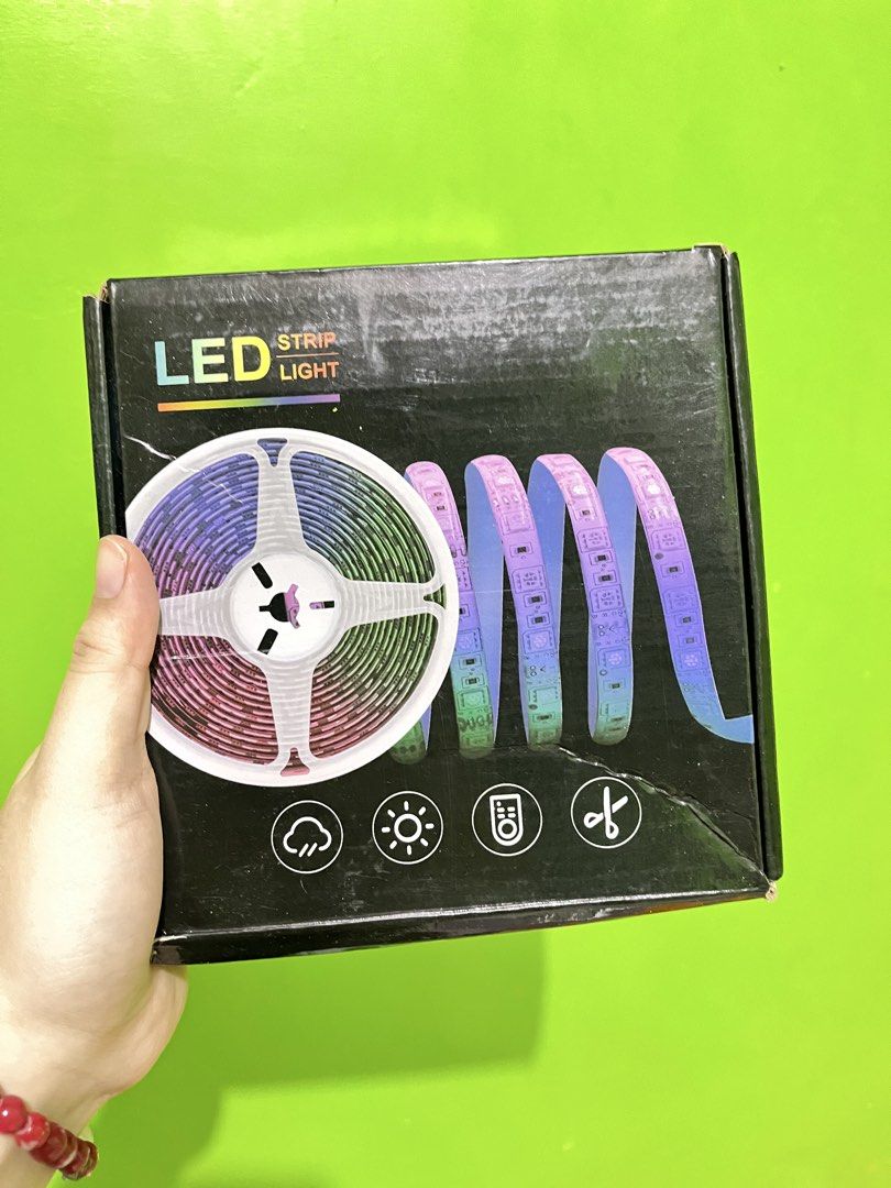 LED Strip Light with Remote and Power Supply (Category: Lighting) located in Manila. Submitted by shannen11 (Listing ID 1465814794, Image 1). Description: - Complete LED strip light set in original box - Includes LED roll on spool, power adapter, controller, cables, and remote - Multi-color lighting capability for custom vibes - Cuttable design to fit any space perfectly - Ready to install for room decor or ambient setups.