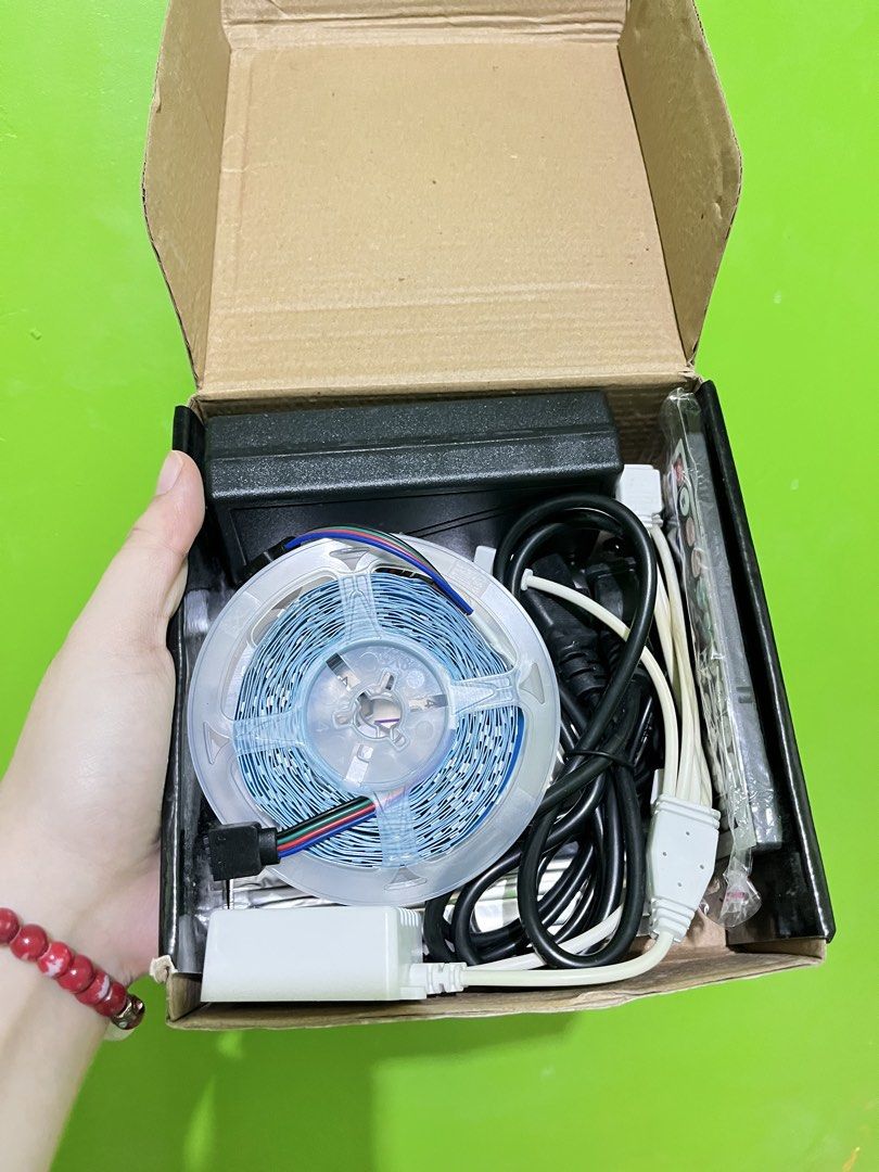 LED Strip Light with Remote and Power Supply (Category: Lighting) located in Manila. Submitted by shannen11 (Listing ID 1465814794, Image 2). Description: - Complete LED strip light set in original box - Includes LED roll on spool, power adapter, controller, cables, and remote - Multi-color lighting capability for custom vibes - Cuttable design to fit any space perfectly - Ready to install for room decor or ambient setups.