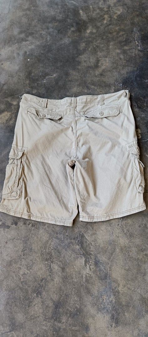 Lee Beige Cargo Shorts with Multiple Pockets (Category: Shorts) located in Manila. Submitted by sandobag (Listing ID 1465820538, Image 2). Description: - Size: 42 L 23 - Excellent condition - Color rate:10/10 - Brand: Lee - Color: Classic beige - Material: Sturdy cotton with contrast stitching - Pockets: Multiple utility pockets on sides and back with secure button closures - Features: Standard zip fly and sturdy belt loops - Versatility: Great f