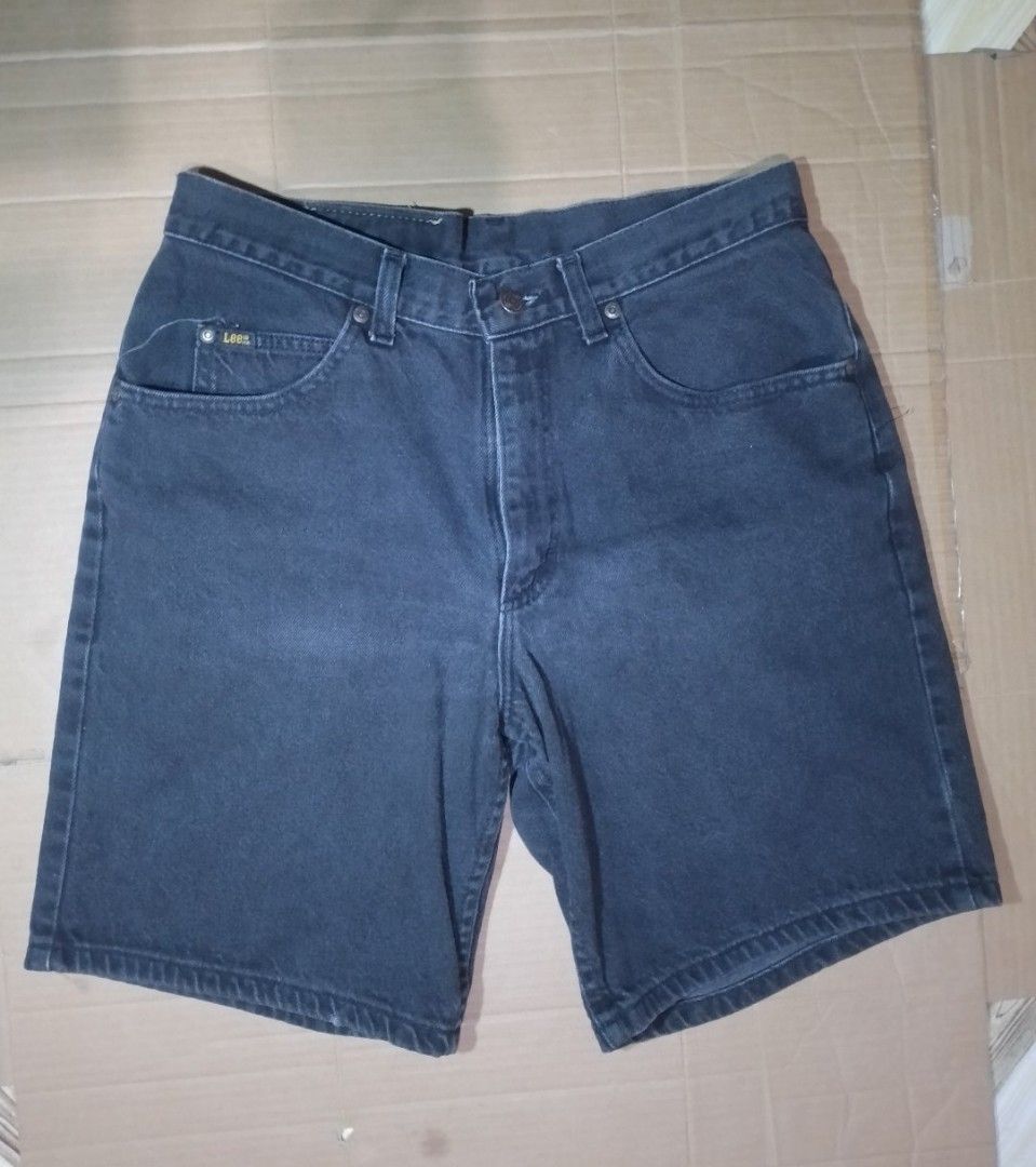 Lee Denim Shorts Black (Category: Shorts) located in Manila. Submitted by cy_thrift (Listing ID 1465905758, Image 1). Description: - Brand: Lee - Color: Classic Black - Closure: Button fly with metal rivets - Pockets: Front pockets with small Lee logo tag - Details: Woven back waistband patch with embossed branding - Condition: Sturdy denim fabric with visible wear on the pocket stitching.