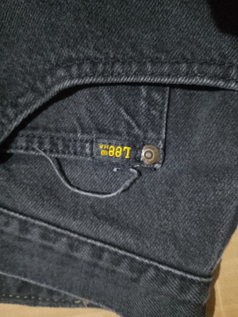 Lee Denim Shorts Black (Category: Shorts) located in Manila. Submitted by cy_thrift (Listing ID 1465905758, Image 2). Description: - Brand: Lee - Color: Classic Black - Closure: Button fly with metal rivets - Pockets: Front pockets with small Lee logo tag - Details: Woven back waistband patch with embossed branding - Condition: Sturdy denim fabric with visible wear on the pocket stitching.