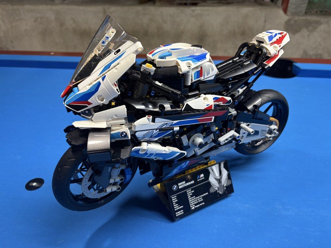 LEGO Technic BMW M 1000 RR (BUILT) (Category: Lego & Building Sets) located in Manila. Submitted by wildtree_7d6348 (Listing ID 1465920017, Image 2). Description: - Fully assembled LEGO Technic BMW M 1000 RR - Features iconic M livery in white, blue, and red - Detailed engine, chain drive, and front/rear suspension - Working steering for realistic display - Includes display stand with spec plaque - Ideal shelf piece for motorcycle and LEGO enthus