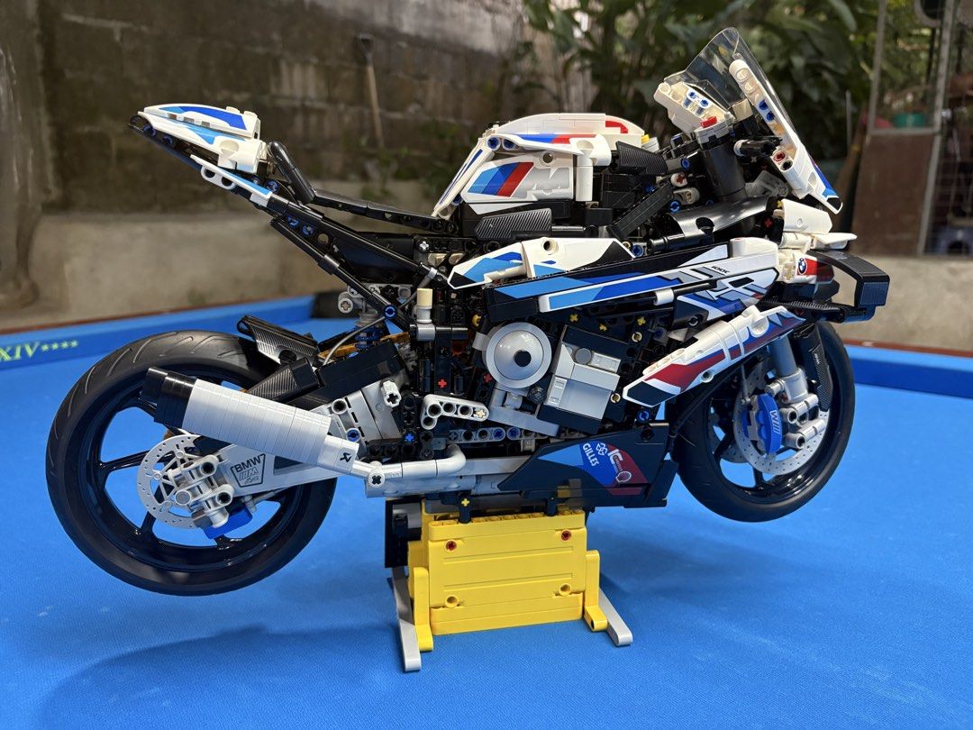 LEGO Technic BMW M 1000 RR (BUILT) (Category: Lego & Building Sets) located in Manila. Submitted by wildtree_7d6348 (Listing ID 1465920017, Image 3). Description: - Fully assembled LEGO Technic BMW M 1000 RR - Features iconic M livery in white, blue, and red - Detailed engine, chain drive, and front/rear suspension - Working steering for realistic display - Includes display stand with spec plaque - Ideal shelf piece for motorcycle and LEGO enthus