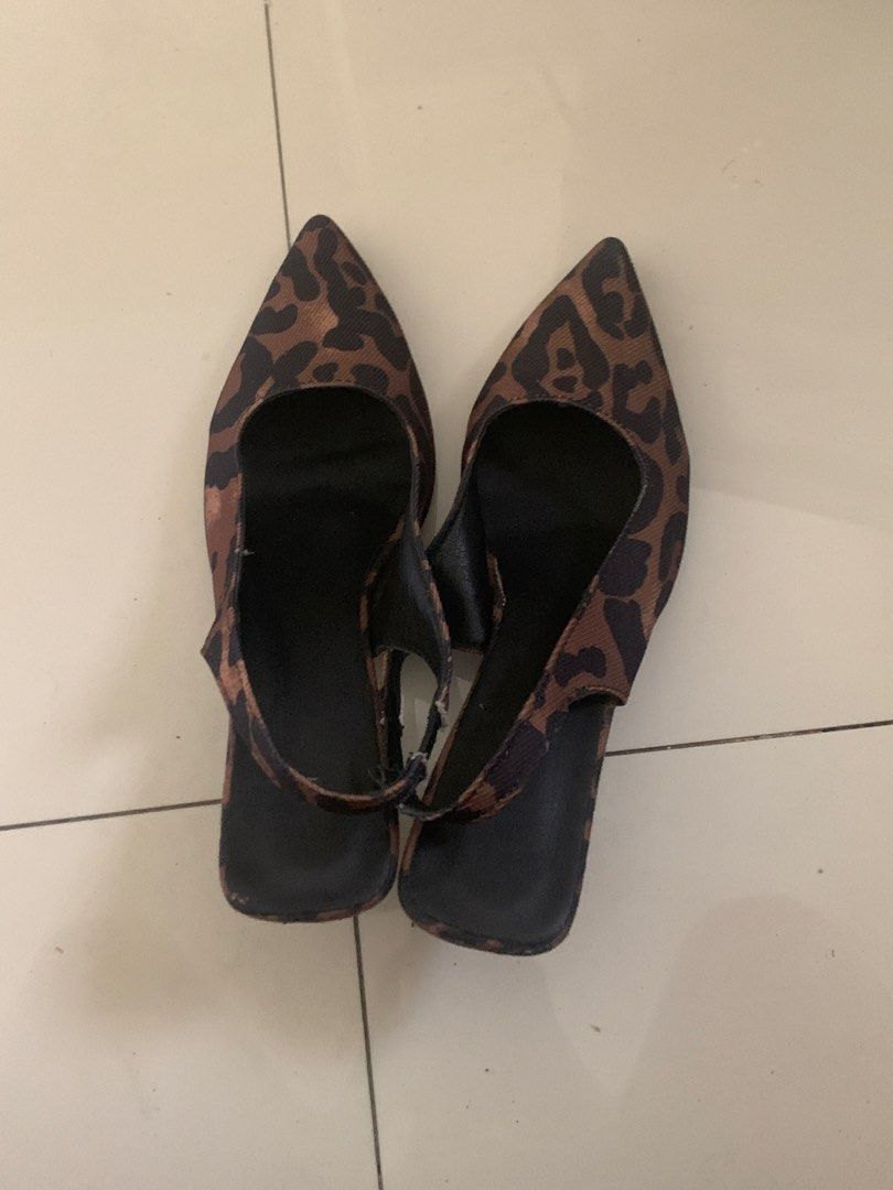 Leopard print pointed toe slingback kitten heels (Category: Heels) located in Manila. Submitted by pureforest_68db5f (Listing ID 1465820395, Image 1). Description: - Style: Leopard print slingback heels with pointed toe and low kitten heel - Size: 240 / EUR 38 - Color: Leopard print upper with black insoles, heel, and elastic strap - Condition: Pre-loved, worn a few times with light wear on the bottom soles and slight fraying on the elastic strap