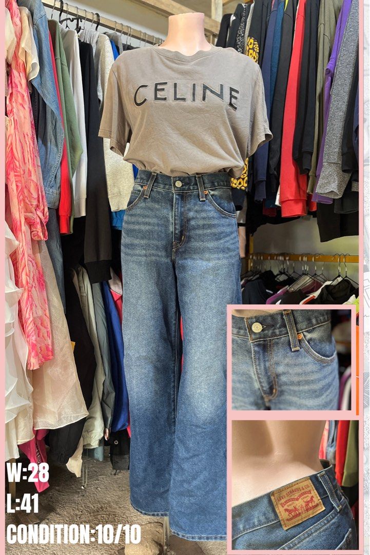 Levi Strauss & Co. Blue Jeans W28 L41 (Category: Jeans) located in Brookes Point. Submitted by grandfish.2f86fc (Listing ID 1465766455, Image 1). Description: - Brand/Model: Levi's Classic Blue Denim Jeans - Wash: Mid-wash with natural fading - Fit: Straight leg cut with standard belt loops and metal button closure - Details: Iconic red leather patch on the back waistband - Size: Waist 28, Length 41 - Condition: Clean, well-maintained, and ready 