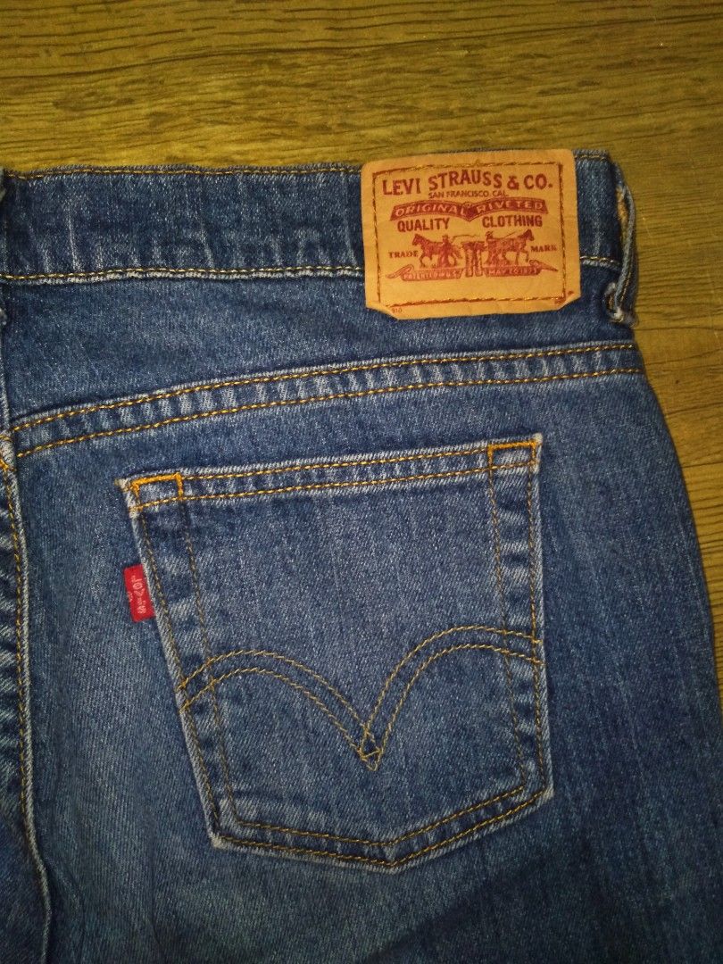 Levi's Boot Cut Denim Jeans Blue (Category: Jeans) located in Manila. Submitted by jaradhiggins24 (Listing ID 1465866661, Image 3). Description: - Brand: Levi's - Style: Boot cut jeans - Wash: Dark blue with heavy fade finish - Fit: Mid-rise with zip fly and button closure - Details: Traditional five-pocket styling, leather brand patch, and iconic red tab - Stitching: Contrast stitching throughout - Condition: Well-maintained and ready to wear - 
