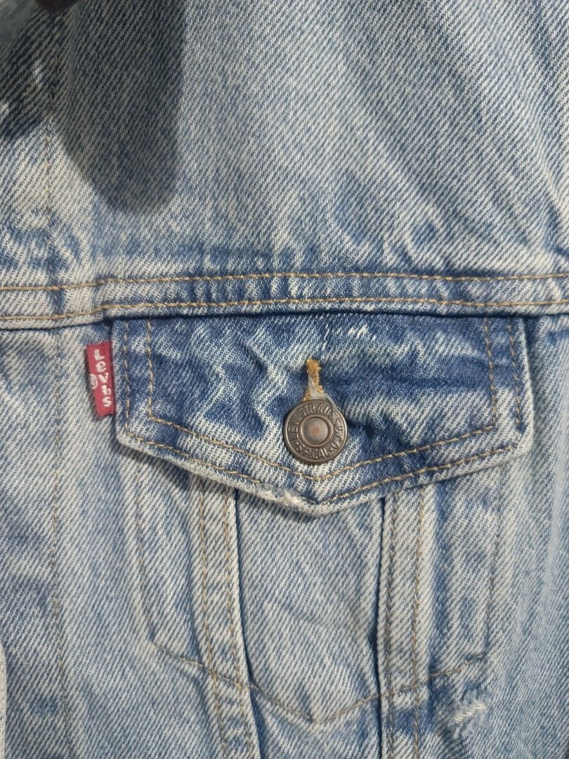 Levi's Classic Light Wash Denim Jacket Size S (Category: Coats, Jackets and Outerwear) located in Iloilo. Submitted by wendxcz-thrift- (Listing ID 1465930957, Image 2). Description: Levi's denim jacket in light blue wash. Classic button-up front with chest flap pockets and side welt pockets. Leather branded patch at the back collar and red tab on the pocket. Size small. Great everyday outer layer. MOP: GCASH/BPI + SF.