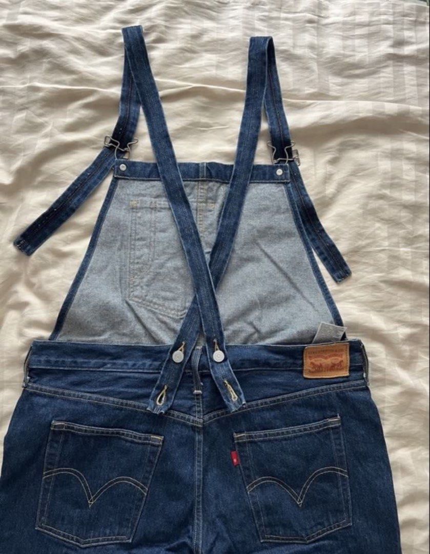 Levi's Denim Overalls Dark Wash (Category: Jumpsuits) located in Pasig City. Submitted by jenscloset86 (Listing ID 1465928869, Image 1). Description: • Levi Strauss & Co. • Classic dark wash denim overalls • Color: Rich indigo • Adjustable cross-back straps, front bib pocket, and multiple utility pockets • Signature red tab, branded metal hardware, and back leather patch • Clean, sturdy, and heavy-duty construction •Perfect forCasual everyday out