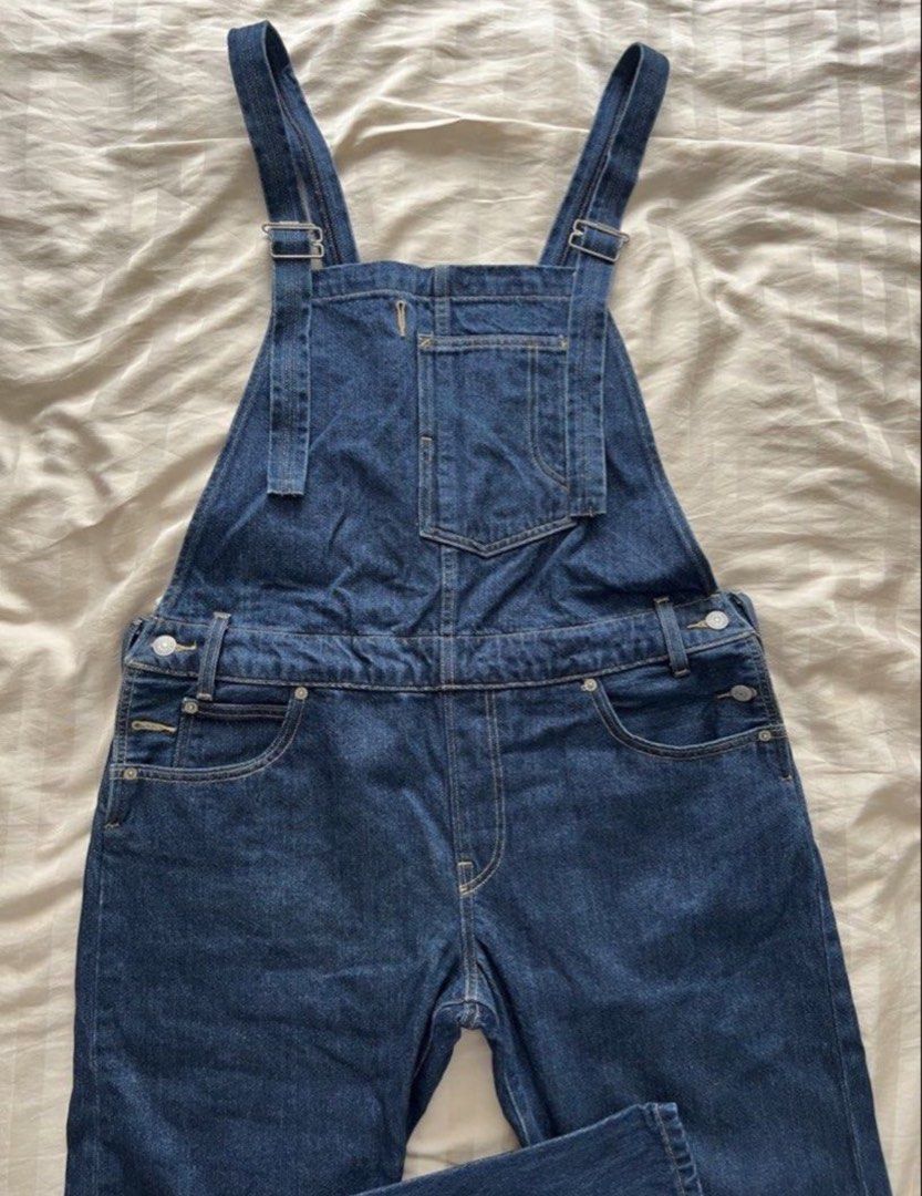 Levi's Denim Overalls Dark Wash (Category: Jumpsuits) located in Pasig City. Submitted by jenscloset86 (Listing ID 1465928869, Image 2). Description: • Levi Strauss & Co. • Classic dark wash denim overalls • Color: Rich indigo • Adjustable cross-back straps, front bib pocket, and multiple utility pockets • Signature red tab, branded metal hardware, and back leather patch • Clean, sturdy, and heavy-duty construction •Perfect forCasual everyday out