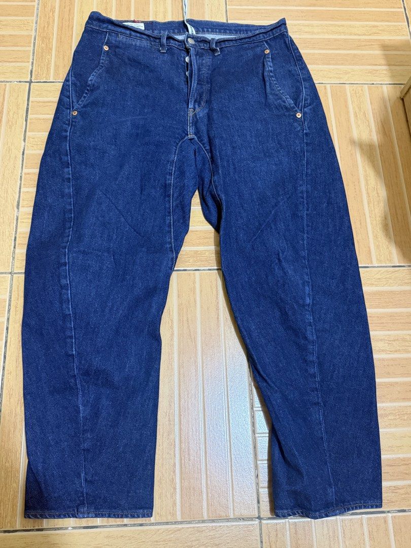 Levi's Engineered Jeans LEJ 570 W31 L30 (Category: Jeans) located in Mandaluyong City. Submitted by kickin_it_thrift (Listing ID 1465933512, Image 1). Description: - Brand/Model: Levi's Engineered Jeans (LEJ 570) - Size: W31 L30 - Wash: Dark blue denim - Design: Distinct curved seam construction on front legs for a unique fit - Closure: Classic button fly - Details: Red leather-look embossed back patch, branded internal hanging tape, and Levi's P