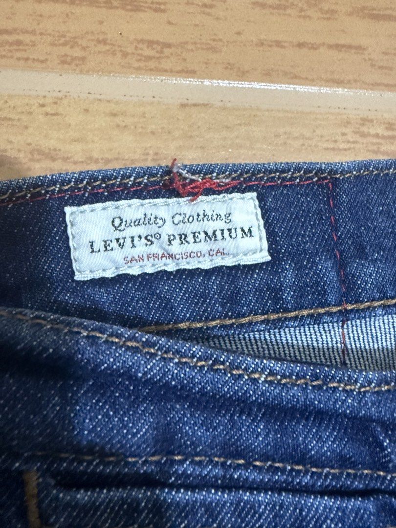 Levi's Engineered Jeans LEJ 570 W31 L30 (Category: Jeans) located in Mandaluyong City. Submitted by kickin_it_thrift (Listing ID 1465933512, Image 2). Description: - Brand/Model: Levi's Engineered Jeans (LEJ 570) - Size: W31 L30 - Wash: Dark blue denim - Design: Distinct curved seam construction on front legs for a unique fit - Closure: Classic button fly - Details: Red leather-look embossed back patch, branded internal hanging tape, and Levi's P