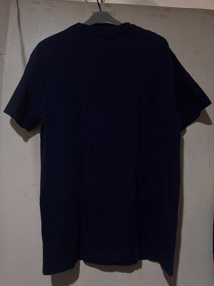 Levis Tshirt (Category: Tshirts & Polo Shirts ) located in Danao, Cebu. Submitted by welvirinec29053 (Listing ID 1465779580, Image 2). Description: This navy blue t-shirt features a faded "S.F. 1853" graphic print across the chest and a small red Levi's tag at the bottom hem. size S fit to medium dimes 19x27 color rate 9.5/10.