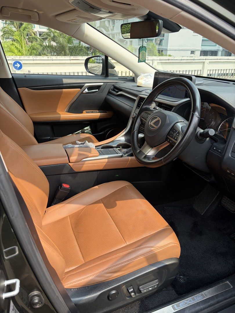 Lexus RX300 2.0 Executive Auto (Category: Used Cars) located in Singapore. Submitted by vvass (Listing ID 1465874357, Image 3). Description: **Rare Colour Combination! Dark Green Exterior With Brown Interior!** 2020 Lexus RX300 Executive in a beautiful and uncommon dark green exterior paired with premium brown interior. A classy and understated colour combination that is rarely seen on the road. Well-maintained and currently clocking **115,000km*