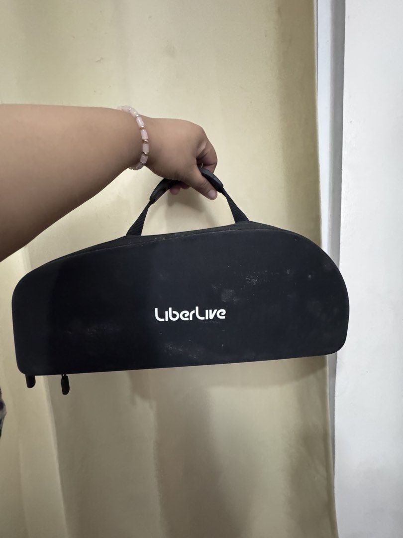 LiberLive C1 Cordless Electric Guitar (Category: Musical Instruments) located in Quezon City. Submitted by marialouisse_ (Listing ID 1465893614, Image 2). Description: - Brand: LiberLive cordless smart guitar - Design: Modern headless style with innovative chord button fretboard - Portability: Compact size, easily fits in your hand or bag for practicing anywhere without a heavy guitar - Included: Original black carrying case with LiberLive logo.