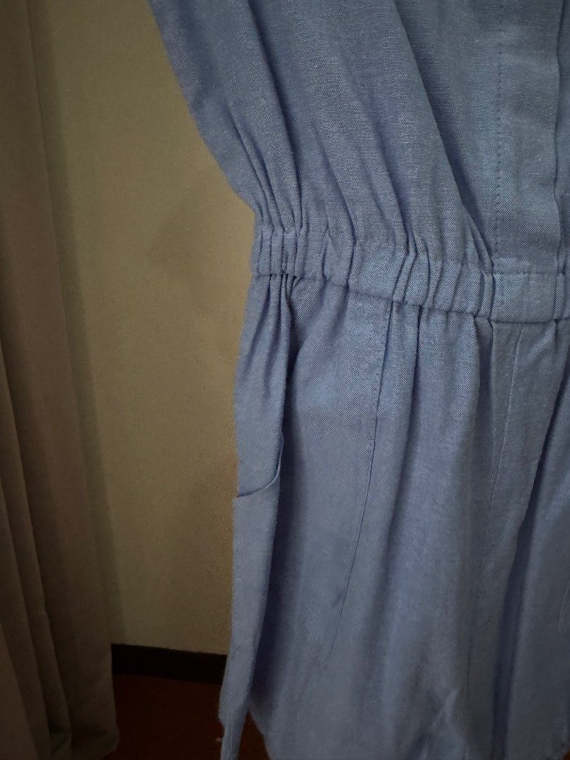 Light Blue Short Sleeve Romper with Pockets (Category: Rompers) located in Pasig City. Submitted by kutleyn (Listing ID 1465759747, Image 3). Description: - Color: Light blue - Style: Short sleeve romper with mandarin collar and front button placket - Waist: Elastic waistband for a comfortable, flattering fit - Pockets: Includes two functional side pockets - Fabric: Lightweight and breathable, ideal for warm weather.