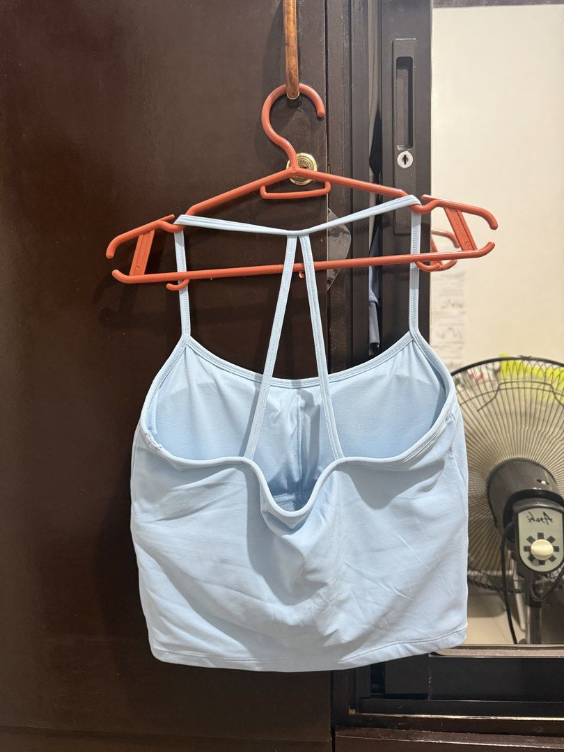 Light Blue Thin Strap Padded Yoga Tank Top (Category: Activewear) located in Caloocan City. Submitted by swnemma (Listing ID 1465863080, Image 2). Description: - Condition: used once. Like new - Color: Light blue - Size: Large - Material: 80% nylon, 20% spandex (soft & stretchy) - Features: Thin straps, racerback design, built-in padding - Best for: Workouts or daily casual wear, yoga, workout top, pickleball .
