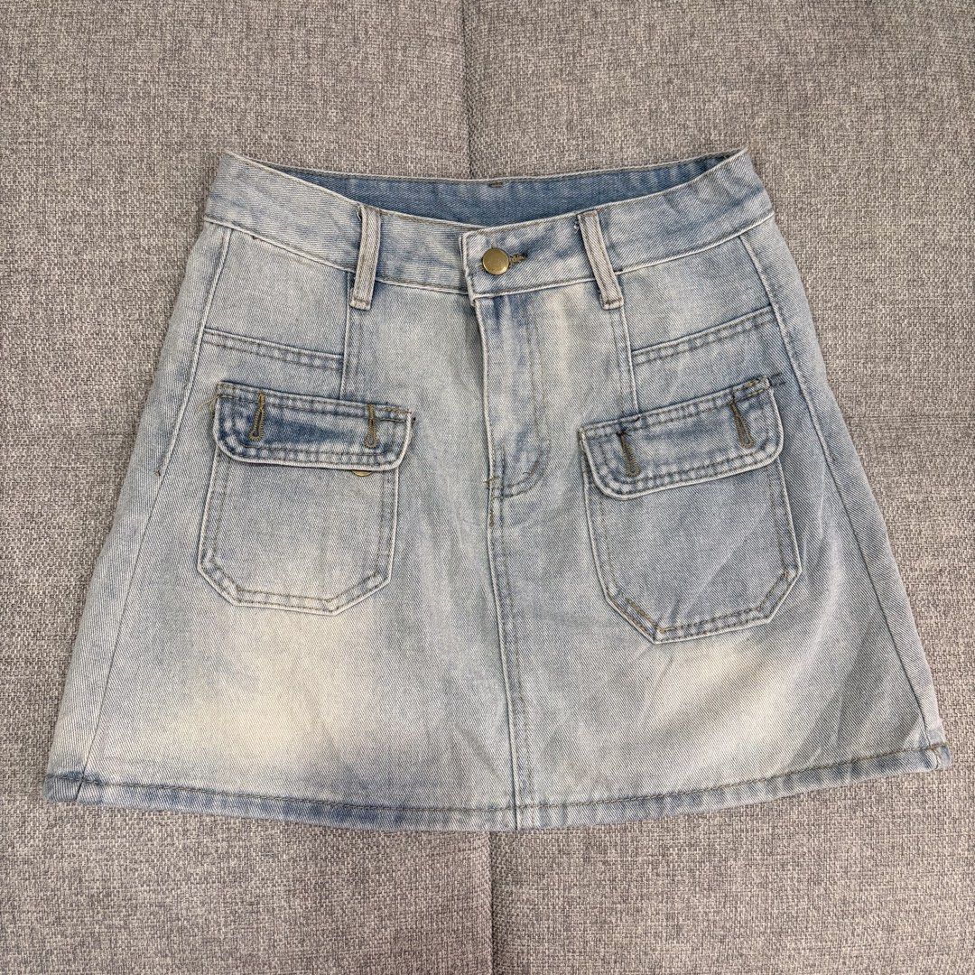 Light wash denim mini skirt with front pockets (Category: Skirts) located in Makati City. Submitted by jinlouise (Listing ID 1465845942, Image 2). Description: - Trendy light blue wash denim skirt - Flattering high-waist fit with belt loops and single button closure - Practical front utility cargo pockets and two classic back pockets - Durable, sturdy denim fabric with stylish slight fading at the hem - Perfect for casual everyday wear and easy t