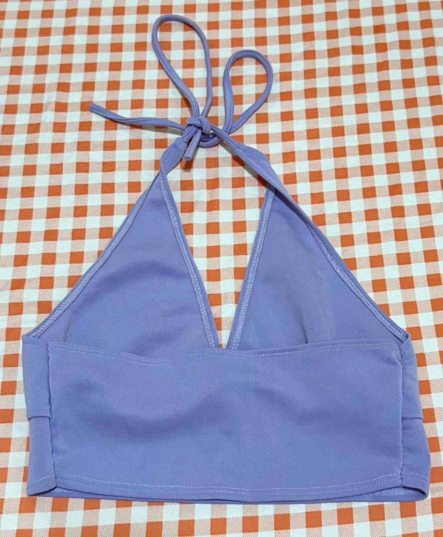 Lilac Purple Halter Neck Crop Top (Category: Sleeveless) located in Quezon City. Submitted by itsmesummeeer (Listing ID 1465943788, Image 2). Description: - Color: Lilac - Style: Halter crop top with V-neck and slight bust gathering - Straps: Adjustable tie straps for a customized fit - Hem: Straight cropped hemline - Material: Smooth and stretchy fabric for all-day comfort - Size: Chest: 12.5”.