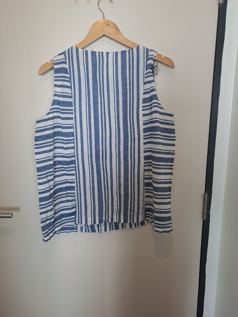 Linen sleeveless (Category: Sleeveless) located in Manila. Submitted by joanbalde39643 (Listing ID 1465862828, Image 2). Description: This is an Andrea Jovine Blue and White Striped Sleeveless Top. This boxy, relaxed-fit linen-cotton blend tank top features a multi-directional striped pattern with vertical stripes running down the center panel and horizontal stripes framing the sides..