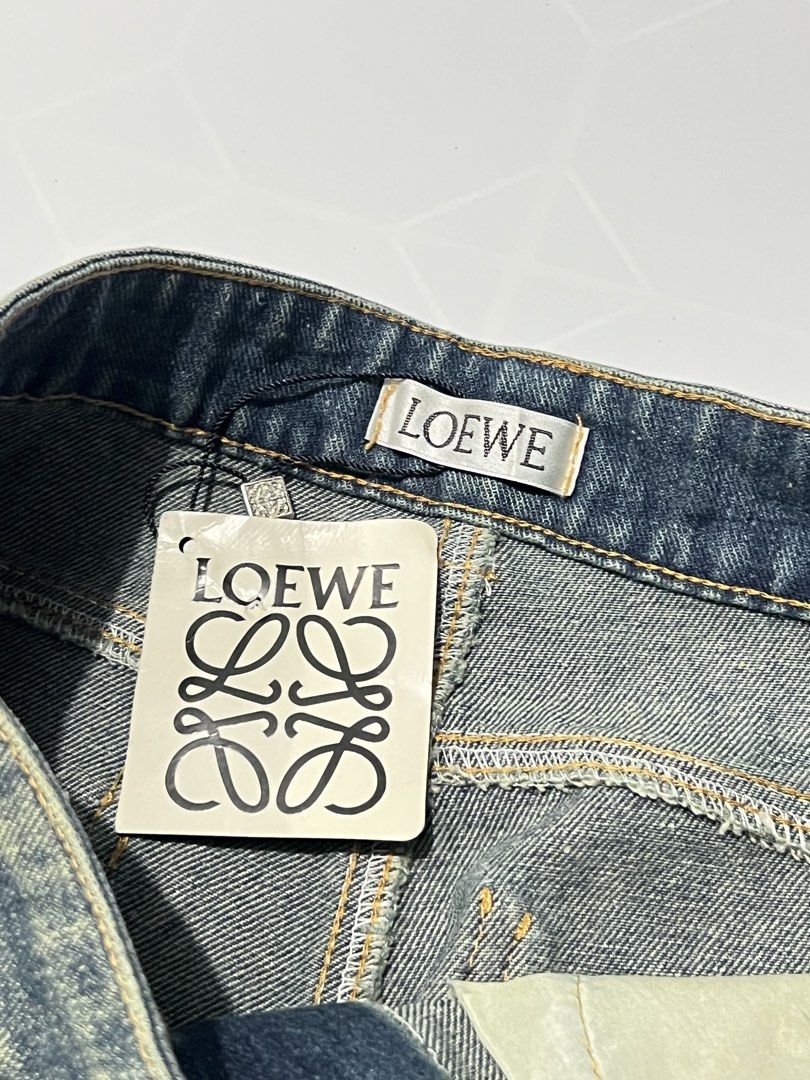 Loewe Rhinestone Distressed Denim Jeans (Category: Jeans) located in Caloocan City. Submitted by lostarchive_55 (Listing ID 1465914539, Image 3). Description: - Brand: Loewe - Style: Straight leg denim jeans - Wash: Faded and distressed - Details: All-over rhinestone embellishments with high sparkle - Condition: Brand new with paper hang tag attached - Features: Branded tag inside the waistband - Perfect statement piece for parties and trendy fit