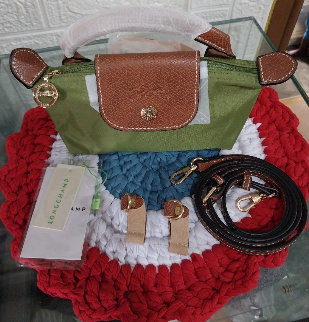 🐎Longchamp Green Mini Le pliage Handbag with Strap (Category: Luxury Bags & Wallets) located in Manila. Submitted by PrinceDani.Clothing (Listing ID 1465827023, Image 2). Description: 🐎longchamp mini le pliage hand bag in moss green color.