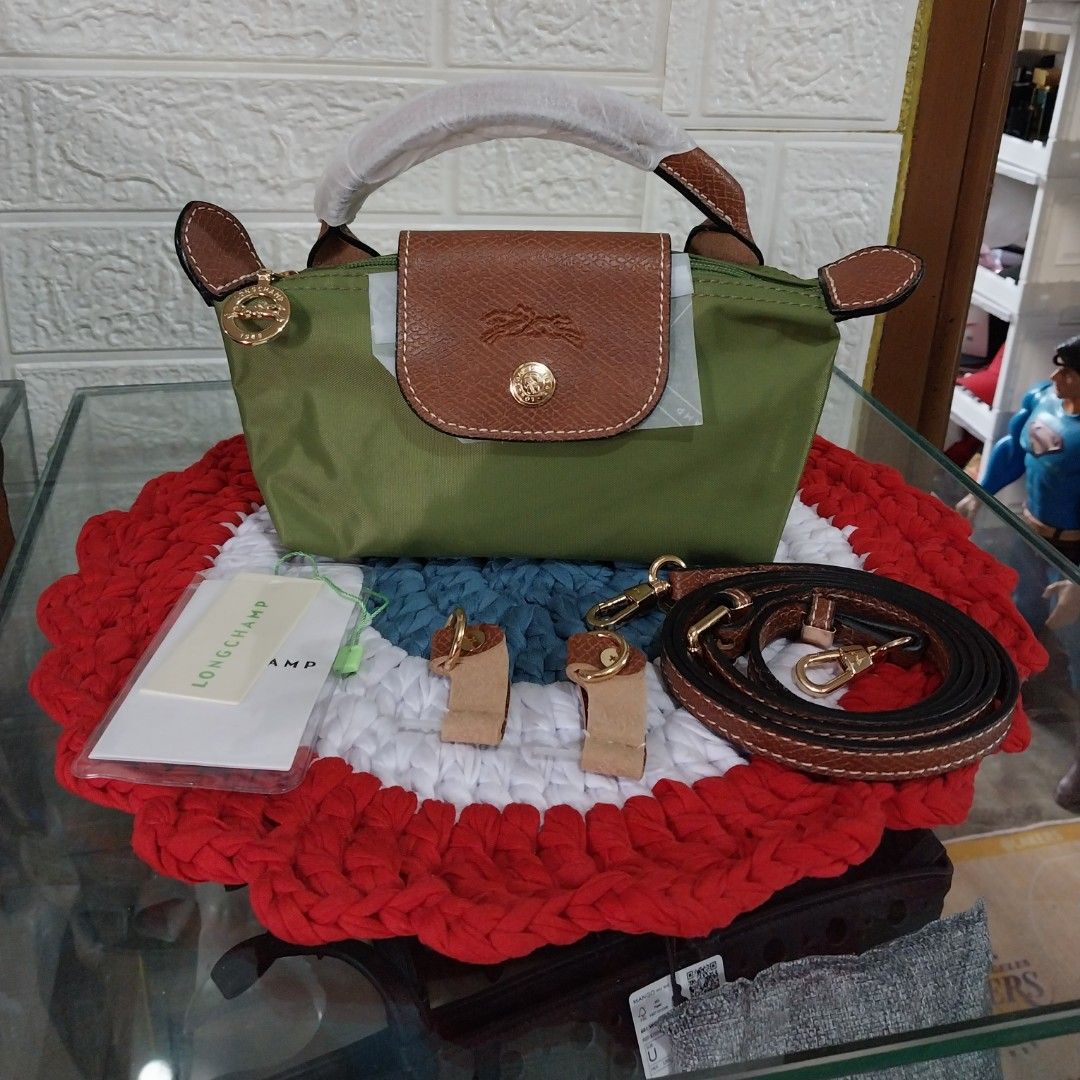 🐎Longchamp Green Mini Le pliage Handbag with Strap (Category: Luxury Bags & Wallets) located in Manila. Submitted by PrinceDani.Clothing (Listing ID 1465827023, Image 1). Description: 🐎longchamp mini le pliage hand bag in moss green color.