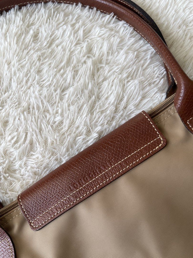 Longchamp Le Pliage Beige Tote Bag (Category: Luxury Bags & Wallets) located in Malolos. Submitted by ishnnt (Listing ID 1465905171, Image 3). Description: - Authentic Longchamp Le Pliage tote bag in classic beige - Durable nylon body with iconic brown leather handles and flap - Elegant gold-tone hardware with signature horse rider logo - Spacious interior, easily fits a laptop and daily essentials - Lightweight, foldable, and perfect for everyda