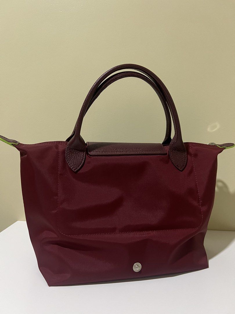 Longchamp Le Pliage handbag burgundy (Category: Luxury Bags & Wallets) located in Manila. Submitted by theprelovedbasics (Listing ID 1465882126, Image 2). Description: Selling my preloved Longchamp Le Pliage small tote. RFS: To buy a bigger one. Free bag organizer DM me for more details!.