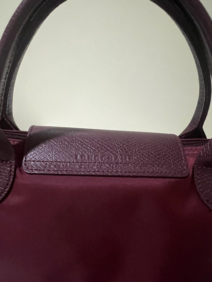 Longchamp Le Pliage handbag burgundy (Category: Luxury Bags & Wallets) located in Manila. Submitted by theprelovedbasics (Listing ID 1465882126, Image 3). Description: Selling my preloved Longchamp Le Pliage small tote. RFS: To buy a bigger one. Free bag organizer DM me for more details!.