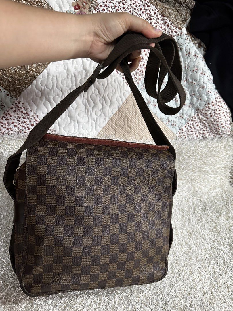 Louis Vuitton Damier Ebene Messenger Bag (Category: Luxury Bags & Wallets) located in Manila. Submitted by aisasalvad24335 (Listing ID 1465803333, Image 2). Description: - Iconic brown checkerboard canvas pattern across the body - Premium dark brown leather trim with embossed Louis Vuitton Paris branding - Adjustable canvas shoulder strap for comfortable wear - Vibrant red fabric interior lining under the front flap - Secure top zip closure and s