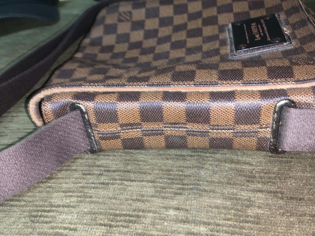 Louis Vuitton Damier Ebene Messenger Bag (Category: Luxury Bags & Wallets) located in San Juan City. Submitted by findmorelux (Listing ID 1465859073, Image 3). Description: - Louis Vuitton messenger bag in iconic brown Damier Ebene canvas - Adjustable brown fabric shoulder strap with sturdy metal hardware hooks - Front flap closure accented with a signature Louis Vuitton engraved metal plaque - Spacious fabric-lined interior with an original leat