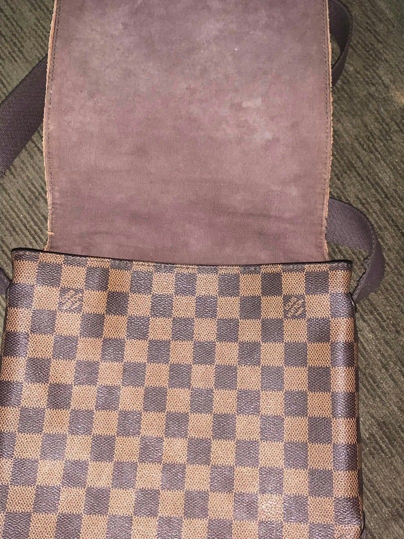 Louis Vuitton Damier Ebene Messenger Bag (Category: Luxury Bags & Wallets) located in San Juan City. Submitted by findmorelux (Listing ID 1465859073, Image 2). Description: - Louis Vuitton messenger bag in iconic brown Damier Ebene canvas - Adjustable brown fabric shoulder strap with sturdy metal hardware hooks - Front flap closure accented with a signature Louis Vuitton engraved metal plaque - Spacious fabric-lined interior with an original leat