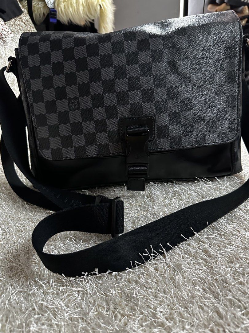 Louis Vuitton Damier Graphite Messenger Bag (Category: Luxury Bags & Wallets) located in Manila. Submitted by aisasalvad24335 (Listing ID 1465802950, Image 1). Description: - Authentic Louis Vuitton messenger bag in iconic Damier Graphite canvas - Durable black leather trim along the bottom panel - Adjustable black strap featuring woven Louis Vuitton lettering - Secure plastic side-release buckle closure on the front flap - Spacious interior layo