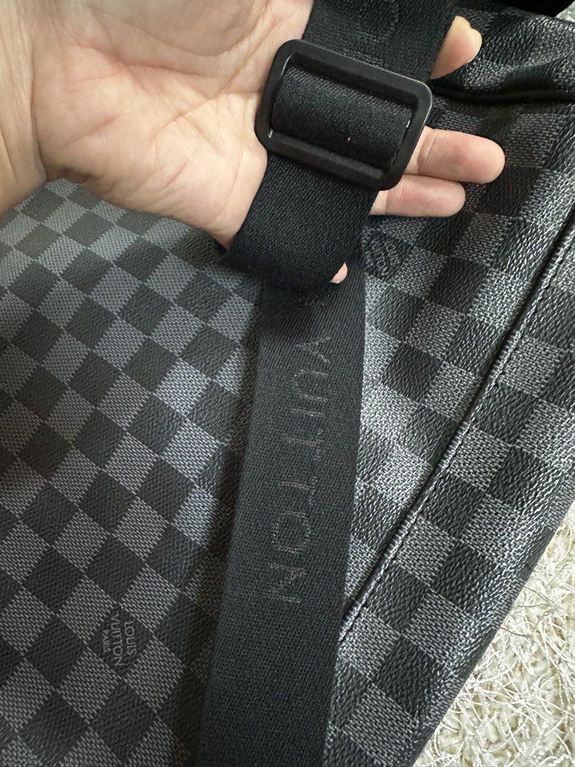 Louis Vuitton Damier Graphite Messenger Bag (Category: Luxury Bags & Wallets) located in Manila. Submitted by aisasalvad24335 (Listing ID 1465802950, Image 3). Description: - Authentic Louis Vuitton messenger bag in iconic Damier Graphite canvas - Durable black leather trim along the bottom panel - Adjustable black strap featuring woven Louis Vuitton lettering - Secure plastic side-release buckle closure on the front flap - Spacious interior layo